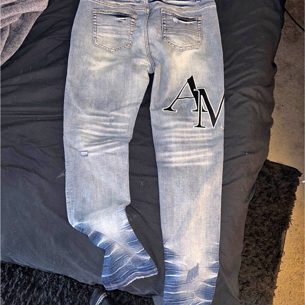 AMIRI Blue Skinny Jeans with Distressed Detailing